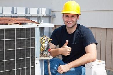 photo of an air conditioning service technician working on an air conditioning unit